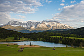 Geroldsee, lake near Mittenwald in Spring with hay barns, Karwendel mountains, Werdenfelser Land, Bavarian Alps, Upper Bavaria, Bavaria, Germany, Europe