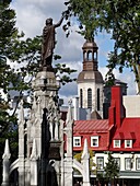 The Monument of Faith, monument-fountain in the Gothic style, carved in granite from Stanstead, was erected on the Place dArmes in Quebec City to commemorate the third centenary of the establishment of the Faith in Canada with the arrival of the Recollet 