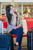 Teenage girl waiting in train station