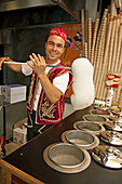 Ice cream vendor with traditional clothing in town center, Bodrum, Mugla, Aegean Sea, Turkish Riviera, Turkey, Europe.