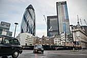 'the Gherkin' by Norman Foster with typical London cab, Liverpool Street, City of London, England, United Kingdom, Europe