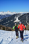 Man and woman back-country skiing ascending towards Gammerspitze, Stubai Alps in the background, Gammerspitze, valley of Schmirn, Zillertal Alps, Tyrol, Austria