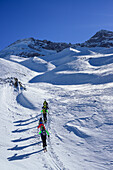 Several persons back-country skiing ascending towards Kleiner Kaserer, Olperer in background, Kleiner Kaserer, valley of Schmirn, Zillertal Alps, Tyrol, Austria