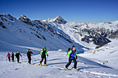 Several persons back-country skiing ascending towards Kleiner Kaserer, Hohe Warte in the background, Kleiner Kaserer, valley of Schmirn, Zillertal Alps, Tyrol, Austria