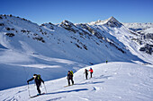 Several persons back-country skiing ascending towards Kleiner Kaserer, Hohe Warte in the background, Kleiner Kaserer, valley of Schmirn, Zillertal Alps, Tyrol, Austria