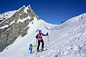 Two persons back-country skiing ascending towards Kleiner Kaserer, Hoellscharte, Kleiner Kaserer, valley of Schmirn, Zillertal Alps, Tyrol, Austria