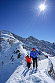 Three persons ascending on ridge towards Kleiner Kaserer, Olperer and Fussstein in background, Kleiner Kaserer, valley of Schmirn, Zillertal Alps, Tyrol, Austria
