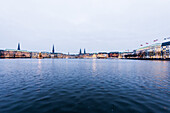 view over the Binnenalster to Jungfernstieg at dusk at Christmas, Hamburg, Germany