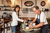 Vera and Reto Balzer preparing Anatoki Salmon, Sans Souci Inn, Pohara, Golden Bay, South Island, New Zealand