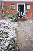 Two boys at the entrance to the house, Cuxhaven, North Sea, Lower Saxony, Germany