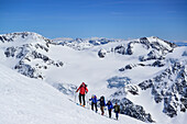 Several persons back-country skiing ascending towards Punta San Matteo, Palon de la Mare and Monte Vioz in the background, Punta San Matteo, Val dei Forni, Ortler range, Lombardy, Italy