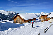 Woman back-country skiing passing Nonsalm towards Gilfert, Gilfert, Tux Alps, Tyrol, Austria