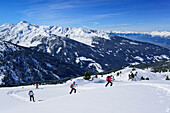 Several persons back-country skiing ascending towards Gilfert, Gilfert, Tux Alps, Tyrol, Austria