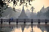 Wat Tranpang Ngoen and reflection in a lake, Old-Sukhothai, Thailand