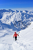 Woman back-country skiing ascending towards Pallspitze, Pallspitze, Langer Grund, Kitzbuehel range, Tyrol, Austria