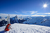 Ski and backpack at summit of Floch, Grosser Rettenstein in background, Floch, valley of Spertental, Kitzbuehel range, Tyrol, Austria