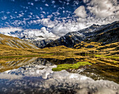 Mount Tyndall, reflection in tarn at Cascade Saddle, Mount Aspiring National Park, New Zealand