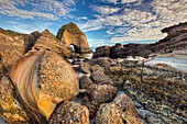 Sedimentary rock with pebbles embedded in layers, Wharariki Beach near Collingwood, Golden Bay, Archway Islands, New Zealand