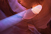 Eroded sandstone and ray of sunlight in Antelope Canyon, Arizona