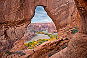 Natural arch with river valley in the background, Canyon de Chelly National Monument, Arizona