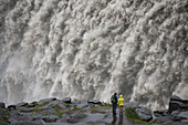 Tourists admiring Dettifoss Waterfall, Vatnajokull National Park, Iceland