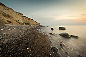 Large stones on a pebble beach at the Baltic Sea in the evening mood, Wustrow, Darss, Mecklenburg Vorpommern, Germany