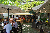 Shady square with Cafe in Palaichora, Troodos mountains, Cyprus