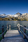 Jetty on the shore of Lake Sils with Piz Lagrev (3164 m), Engadin, Grisons, Switzerland