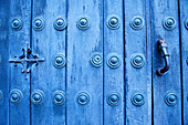 Blue door with door knocker in the wihite town of Arcos de la Frontera, Cadiz province, Andalusia, Spain, Europe