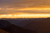 The first light of the sun over the Saane Valley, the mountain chains of Stockhorn and Gantrisch in the background, Bernese Alps, canton of Bern, Switzerland