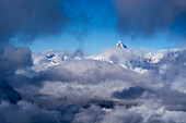 The summit of the Bietschhorn surrounded by clouds, Bernese Alps, canton of Valais, Switzerland
