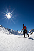 Man on touring skis, Grisons, Switzerland, Europe