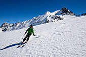 Ski-tourer on the Vadret da Grialetsch with Piz Sarsura (3178 m) above him, Grisons, Switzerland, Europe