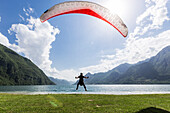 Paraglider at the shore of lake Idro, Baitoni, Lombardia, Trentino, Italy
