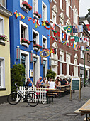 Kreuzstraße with students' pub Blaue Haus , Muenster , Muensterland , North Rhine-Westphalia , Germany , Europe