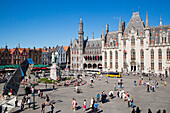 People on Grote Markt market square in Old Town, Bruges (Brugge), Flemish Region, Belgium