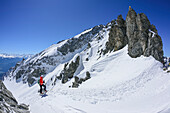 Woman back-country skiing ascending towards Scharnitzsattel, Scharnitzsattel, Lechtal Alps, Tyrol, Austria