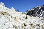 Woman back-country skiing crossing avalanche, Similaun, valley of Pfossental, valley of Schnalstal, Vinschgau, Oetztal Alps, South Tyrol, Italy