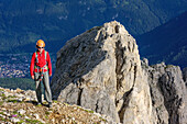 Woman ascending towards Rotwand, Rotwand, Rosengarten, UNESCO world heritage Dolomites, Dolomites, Trentino, Italy