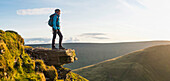 Panoramic view of hiker overlooking remote landscape, Rural, None, UK