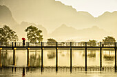 Mountains and bridge reflected in still lake, Hpa an, Kayin, Myanmar, Hpa an, Kayin, Myanmar
