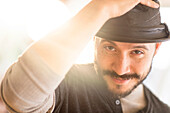 Hispanic man tipping his hat, Jersey City, NJ, USA