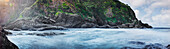 Panoramic view of waves washing up on rocky beach, C1