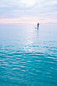 Caucasian man standing on paddleboard in ocean, Miami Beach, Florida, United States