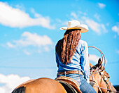 Caucasian cowgirl riding horse in rodeo outdoors, Joseph, Oregon, USA