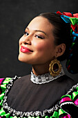 Hispanic teenage girl wearing Jallisco Folkloric dress, Petaluma, California, United States