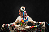 Hispanic teenage girl dancing in Sinaloa Folkloric dress, Petaluma, California, United States