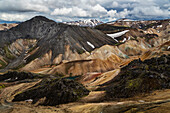 Snowy mountains and rhyolite formations in remote landscape, Landmannalaugar, Iceland, Iceland