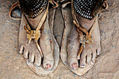 Close up sandy feet of woman in sandals, Sesfontein, Kunene Region, Namibia