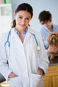 Caucasian veterinarian smiling in office, Jersey City, New Jersey, USA